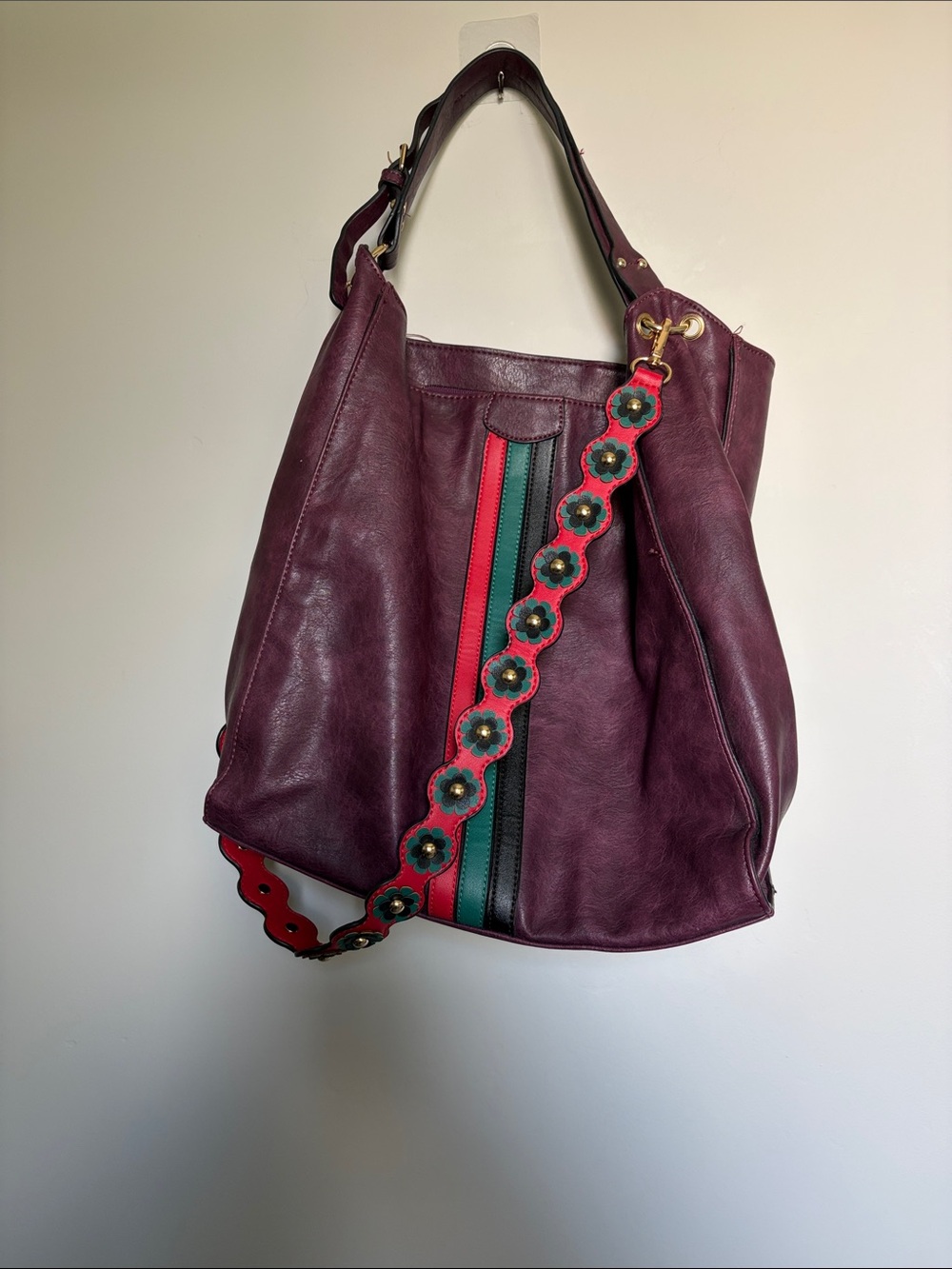 Large Burgundy leather bag with red and green accents